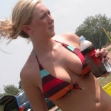 Candid pictures of busty girls at the beach in bikinis