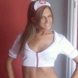Adri dresses up as a naughty nurse with white fishnets
