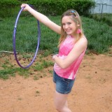 Petite teen Shelby plays around with a hoola hoop
